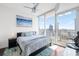 Bright bedroom featuring floor-to-ceiling windows with sliding glass door to the balcony at 777 N Ashley Dr # 2610, Tampa, FL 33602