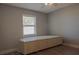 Bedroom offering a built-in storage unit and a window that provides natural light at 7827 Crosier Ct, New Port Richey, FL 34653