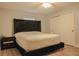 Bedroom featuring a comfortable bed, a nightstand with drawers, and a closet with sliding doors at 7827 Crosier Ct, New Port Richey, FL 34653