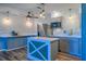 Stylish kitchen featuring two-tone cabinets, a center island, stainless steel appliances, and sleek countertops at 7827 Crosier Ct, New Port Richey, FL 34653