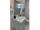 Stylish bathroom with modern vanity, mirror, and updated fixtures at 7912 Causeway S Blvd, St Petersburg, FL 33707