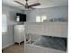 Charming bedroom featuring bunk beds, dresser, and a ceiling fan at 7912 Causeway S Blvd, St Petersburg, FL 33707