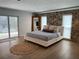 Bedroom with a stone wall, a mirror, a jute rug, and sliding doors to the outside at 7912 Causeway S Blvd, St Petersburg, FL 33707