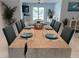 Large dining room table with seating for eight and view of the living room and pool at 7912 Causeway S Blvd, St Petersburg, FL 33707