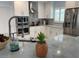 Modern kitchen featuring stainless steel appliances, white cabinets and granite counter tops at 7912 Causeway S Blvd, St Petersburg, FL 33707