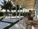 Covered patio with multiple seating areas and views of the water at 7912 Causeway S Blvd, St Petersburg, FL 33707
