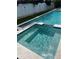 Backyard pool and spa with artificial turf and white fencing at 7912 Causeway S Blvd, St Petersburg, FL 33707