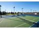 Expansive tennis and recreational area offers multiple courts, lighting, and amenities for an active lifestyle at 8094 Painted Sky Pl, Land O Lakes, FL 34637