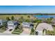 Aerial view of residential houses close to the lake and surrounded by natural, scenic beauty at 8247 Westhaven Dr, Land O Lakes, FL 34638