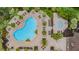 Aerial view of community pool featuring small pool, lounge chairs and tables at 8247 Westhaven Dr, Land O Lakes, FL 34638