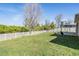 Expansive backyard with lush lawn and a white fence perfect for outdoor activities at 8247 Westhaven Dr, Land O Lakes, FL 34638