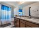 Bathroom featuring a double vanity with granite counters, a tub, and tiled shower at 8247 Westhaven Dr, Land O Lakes, FL 34638
