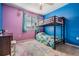 Bright bedroom with a bunk bed, colorful walls, plush carpet, and a window at 8247 Westhaven Dr, Land O Lakes, FL 34638