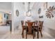 Inviting dining room featuring a dark wood table, six chairs and decorative wall art at 8247 Westhaven Dr, Land O Lakes, FL 34638