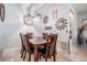 Inviting dining room featuring a dark wood table, six chairs and decorative wall art at 8247 Westhaven Dr, Land O Lakes, FL 34638
