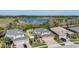 Inviting two-story home with a three-car garage, situated near a tranquil lake and lush greenery at 8247 Westhaven Dr, Land O Lakes, FL 34638