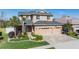Charming two-story home boasts a manicured lawn, brick driveway, and an attached three-car garage at 8247 Westhaven Dr, Land O Lakes, FL 34638