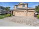 Lovely two-story home featuring a paver driveway, manicured landscaping, and neutral tones at 8247 Westhaven Dr, Land O Lakes, FL 34638