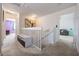 Hallway showcasing a staircase, adjacent rooms, and carpet flooring at 8247 Westhaven Dr, Land O Lakes, FL 34638