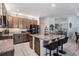 Spacious kitchen with granite countertops, a large island, stainless steel appliances, and ample cabinet space at 8247 Westhaven Dr, Land O Lakes, FL 34638