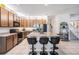 Beautiful kitchen featuring a large island with barstool seating, granite countertops, and stainless steel appliances at 8247 Westhaven Dr, Land O Lakes, FL 34638