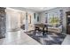 Spacious living area featuring tiled floors, front door, and foosball table at 8247 Westhaven Dr, Land O Lakes, FL 34638