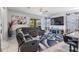 Spacious living area with sectional sofa and open layout to the kitchen and outdoor views at 8247 Westhaven Dr, Land O Lakes, FL 34638