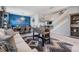 Open living space featuring sofa, staircase, dining area and foosball table at 8247 Westhaven Dr, Land O Lakes, FL 34638
