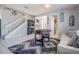 Open living space with foosball table, staircase and decorative rug at 8247 Westhaven Dr, Land O Lakes, FL 34638