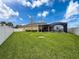 The expansive backyard includes a screened pool area, manicured lawn, and privacy fence at 8578 Gibbons Grove Loop, Land O Lakes, FL 34637