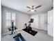 Bedroom features a ceiling fan, natural light, carpet flooring, and two closets for storage at 8578 Gibbons Grove Loop, Land O Lakes, FL 34637