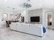 Spacious living area with stone fireplace, open floor plan, and staircase at 8578 Gibbons Grove Loop, Land O Lakes, FL 34637