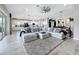 Open-concept living space with a gourmet kitchen, comfortable living room, and stylish decor at 8578 Gibbons Grove Loop, Land O Lakes, FL 34637