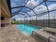 Enjoy the serene pool area with lounge chairs and a view of the well-maintained yard at 8578 Gibbons Grove Loop, Land O Lakes, FL 34637