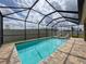 Relaxing screened pool with comfortable seating and a clear view at 8578 Gibbons Grove Loop, Land O Lakes, FL 34637
