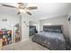 Bedroom featuring a large bed, mirrored closet, and ceiling fan at 8766 91St St, Seminole, FL 33777