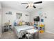 Bedroom featuring ceiling fan, window and twin-size bed at 8766 91St St, Seminole, FL 33777