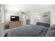 Bedroom featuring a large bed, dresser and closet at 8766 91St St, Seminole, FL 33777