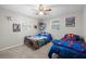 Bedroom featuring ceiling fan, two windows and twin beds for children at 8766 91St St, Seminole, FL 33777