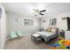 Bedroom featuring ceiling fan, two windows and twin-size bed at 8766 91St St, Seminole, FL 33777
