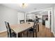Dining room featuring wood flooring with views to the living room and kitchen at 8766 91St St, Seminole, FL 33777