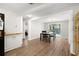 Bright dining room featuring wood flooring and a view to the enclosed patio at 8766 91St St, Seminole, FL 33777