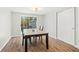 Bright dining room featuring wood flooring and sliding glass doors at 8766 91St St, Seminole, FL 33777