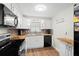 Efficient kitchen with stainless steel appliances, butcher block counters, and white cabinetry at 8766 91St St, Seminole, FL 33777