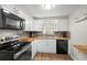 Well-lit kitchen with stainless appliances, wood countertops and plenty of cabinet space at 8766 91St St, Seminole, FL 33777