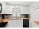 Bright kitchen featuring wood countertops, gray subway tile backsplash, and white cabinetry at 8766 91St St, Seminole, FL 33777