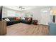 Spacious living room with laminate flooring, natural light, and comfortable seating at 8766 91St St, Seminole, FL 33777