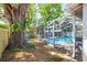 Enjoy the backyard with a screened-in pool area, perfect for relaxation and entertainment at 8766 91St St, Seminole, FL 33777