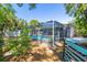 The backyard features a screened-in pool area, providing a private and relaxing outdoor space at 8766 91St St, Seminole, FL 33777