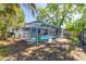 A screened-in pool area offers a private and refreshing outdoor space with lush greenery around at 8766 91St St, Seminole, FL 33777